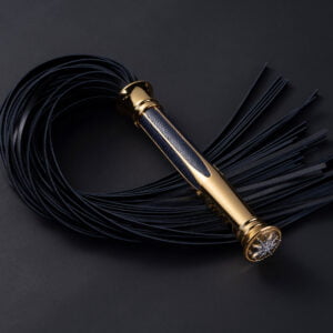 goud met zwart leer flogger